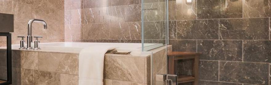 bathtub with marble tiling after bathroom remodeling in Reading, Andover, Stoneham, Wakefield, and Hamilton, MA